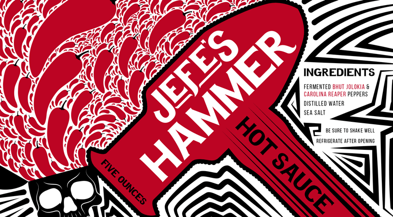 Sauce bottle label with repeating pepper icons on left, large red hammer icon with text in middle, and black and white pattern on right